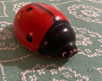 Wooden pull along ladybird on wheels toy. Animal. Carved wood.decorative. Classic toys. red black