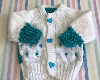 Turquoise and white home made knitted cardigan.heart buttons. Knitting pattern. Blue. Newborn.