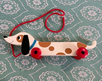 Wooden pull along sausage dog toy. Animal.  toys. Carved wood.decorative. Classic toy. daschund