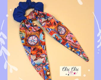 Scrunchie with large bow and Sicilian-inspired pattern.
