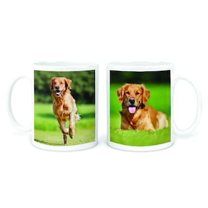 May include: Two white ceramic mugs featuring images of a golden retriever dog. One mug depicts the dog running in a grassy field, while the other mug shows the dog lying down in the grass.
