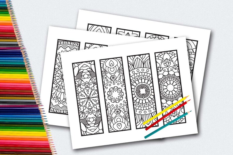 May include: Four black and white printable bookmark designs with intricate patterns. Each bookmark features a different mandala-like design.