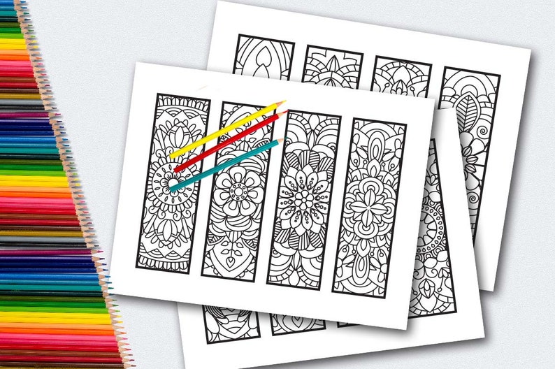 May include: Five black and white printable bookmark designs featuring intricate floral patterns. The bookmarks are rectangular and have a black border.