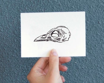 Original linocut of a bird skull