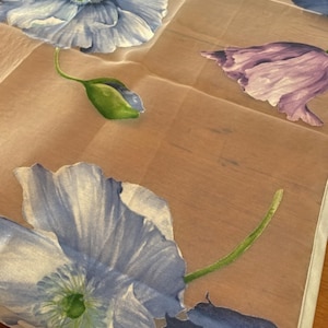 May include: A trio of ceramic mugs with a speckled, matte finish in light blue, cream, and grey. The mugs have a simple, modern design and a comfortable handle. Ideal for tea or coffee.