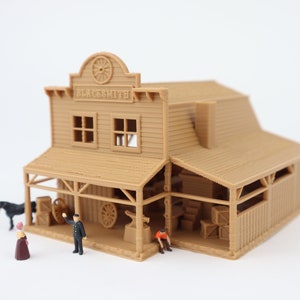 May include: A brown wooden model of a blacksmith shop with a sign that reads "Blacksmith". There are miniature figures of people standing in front of the shop.
