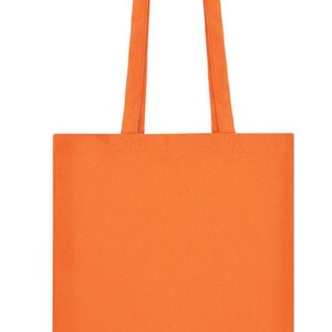 May include: A solid orange tote bag with matching handles. The bag is rectangular with a simple design, suitable for carrying various items. The handles are long enough to be worn over the shoulder.
