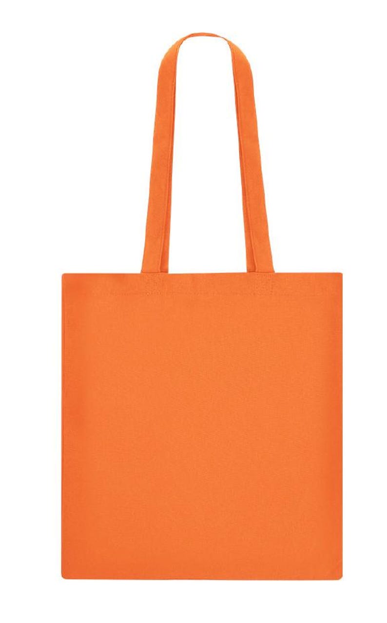 May include: A solid orange tote bag with matching handles. The bag is rectangular with a simple design, suitable for carrying various items. The handles are long enough to be worn over the shoulder.