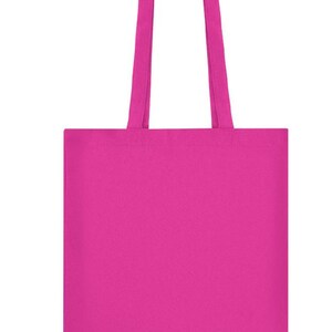 May include: A solid magenta tote bag with matching handles. The bag is rectangular with a simple, clean design, suitable for carrying various items. The handles are long enough to be worn over the shoulder.