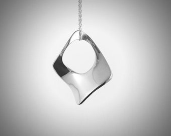 Contemporary necklace pendent gift silver abstract necklace Sleek minimalist Design technical skills balance between matter and form.