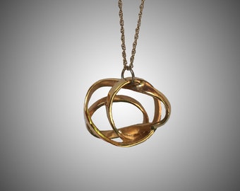 Energy sculptural loop design, Gift Contemporary necklace pendent, Gold abstract necklace, Designed to commemorate the world travels, best