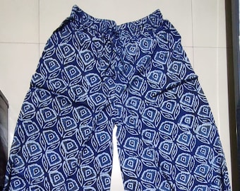 May include: Blue and white patterned palazzo pants with an elastic waistband and a drawstring.