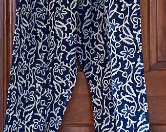 May include: Blue and white patterned pants with a floral design. The pants have an elastic waistband.