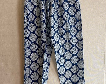 May include: Blue and white patterned pants with a drawstring waist.