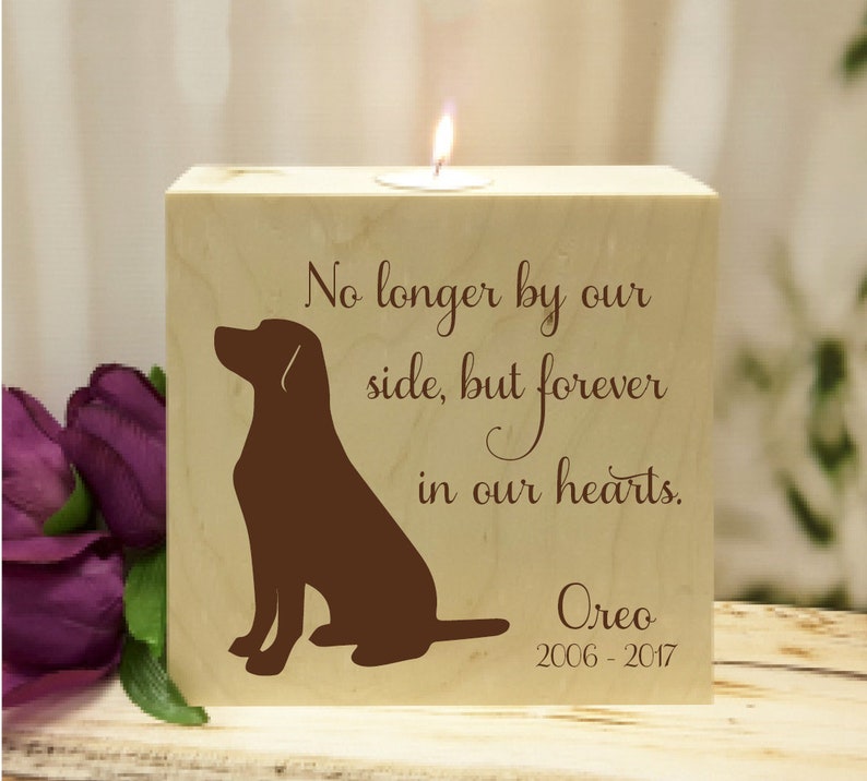 May include: Wooden candle holder with a silhouette of a dog and the text "No longer by our side, but forever in our hearts. Oreo 2006-2017".