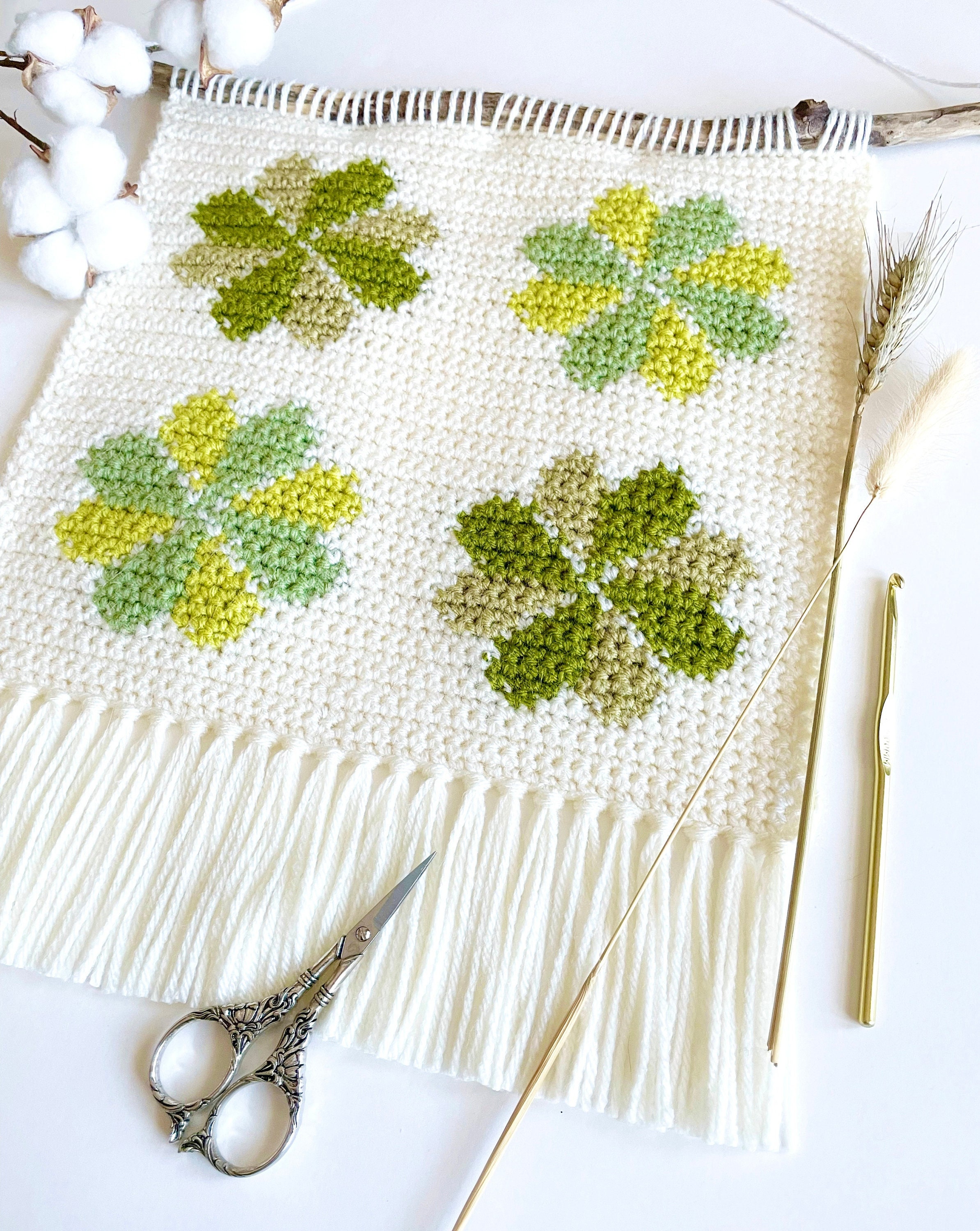 34 Fun Crochet Clover Patterns Perfect for St. Patrick’s Day 10 Crochet Pattern The Clover Field Wall Hanging Crochet
