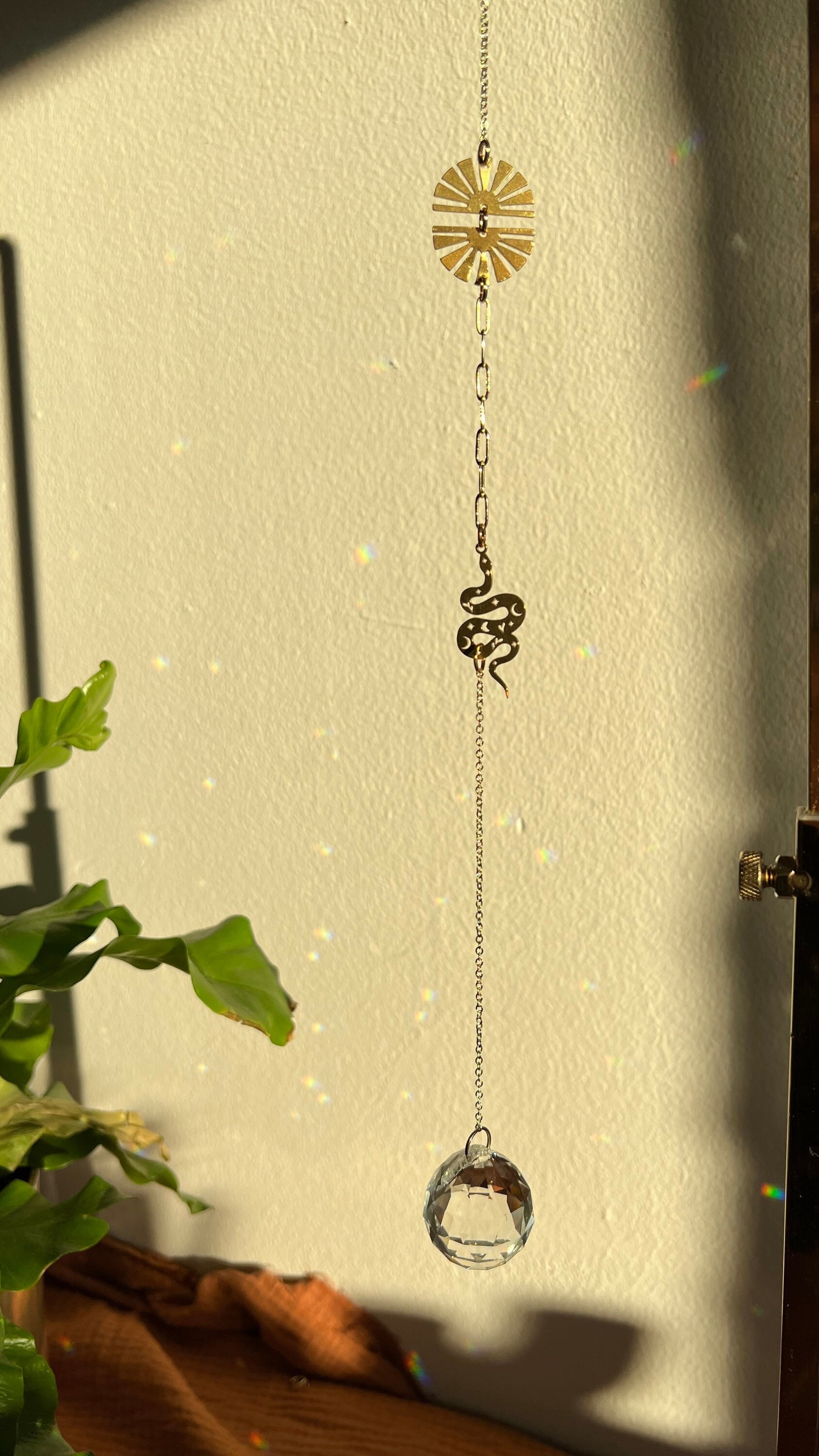 Snake Suncatcher with rising sun, mid century inspired, modern home decor, crystal prism