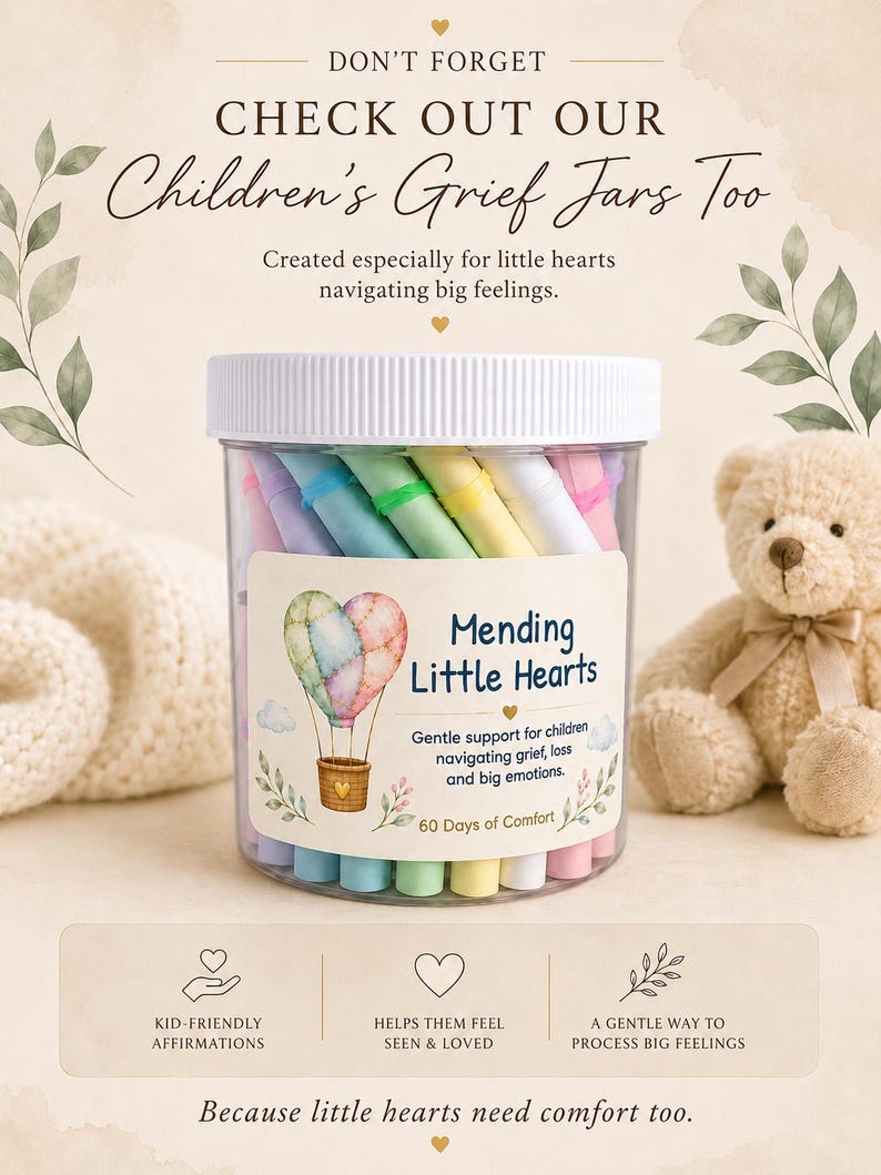 May include: A clear plastic jar filled with pastel-colored paper scrolls. The label features a watercolor hot air balloon heart, the text Mending Little Hearts, and the phrase 60 Days of Comfort. The jar has a white lid and contains affirmations.