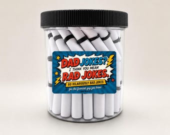 May include: A clear plastic jar with a black ribbed lid filled with white paper scrolls tied with black bands. The label features a blue comic-style background with yellow stars and the text: DAD JOKES? I THINK YOU MEAN RAD JOKES. 60 HILARIOUSLY BAD JOKES for the funniest guy you know.