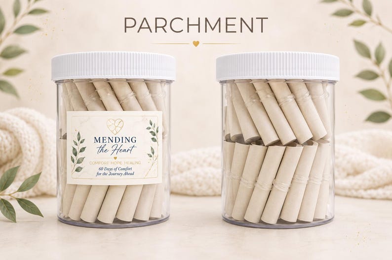 May include: Two clear plastic jars with white lids filled with rolled parchment paper scrolls. The left jar features a label with the text MENDING the Heart, COMFORT HOPE HEALING, and 60 Days of Comfort for the Journey Ahead, decorated with green leaves.