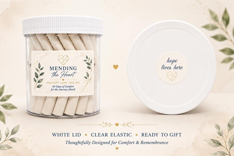 May include: A clear plastic jar with a white lid containing rolled paper slips. The label reads MENDING the Heart, COMFORT HOPE HEALING, 60 Days of Comfort for the Journey Ahead. The lid features a sticker with the text hope lives here.