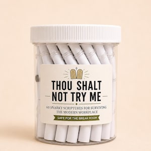 May include: A clear plastic jar with a white lid filled with white paper scrolls. The label features an icon of stone tablets and the text: THOU SHALT NOT TRY ME, 60 SNARKY SCRIPTURES FOR SURVIVING THE MODERN WORKPLACE, SAFE FOR THE BREAK ROOM.