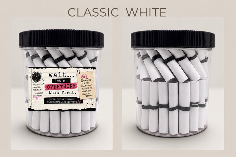 May include: A clear plastic jar with a black ribbed lid filled with white paper scrolls tied with black bands. The label reads: wait... let me OVERTHINK this first. 60 REMINDERS FOR THE BRAIN THAT REFUSES TO SHUT THE HELL UP. EXCELLENT AT THINKING. QUESTIONABLE AT STOPPING.