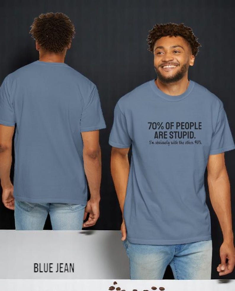 May include: A blue jean colored short-sleeve t-shirt featuring the black printed text 70% OF PEOPLE ARE STUPID. I'm obviously with the other 40%. The shirt is shown from both the front and back views, displaying a crew neckline and a standard fit.