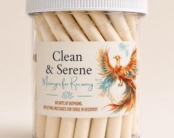 May include: A clear plastic jar with a white lid containing rolled paper scrolls. The label features a phoenix illustration and the text: Clean & Serene Messages for Recovery, 60 days of inspiring, uplifting messages for those in recovery.