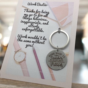 May include: A greeting card with a pink background and the words "Work Bestie" and "Work made us coworkers but our potty mouths & inappropriate conversations made us friends." A silver keychain is attached.