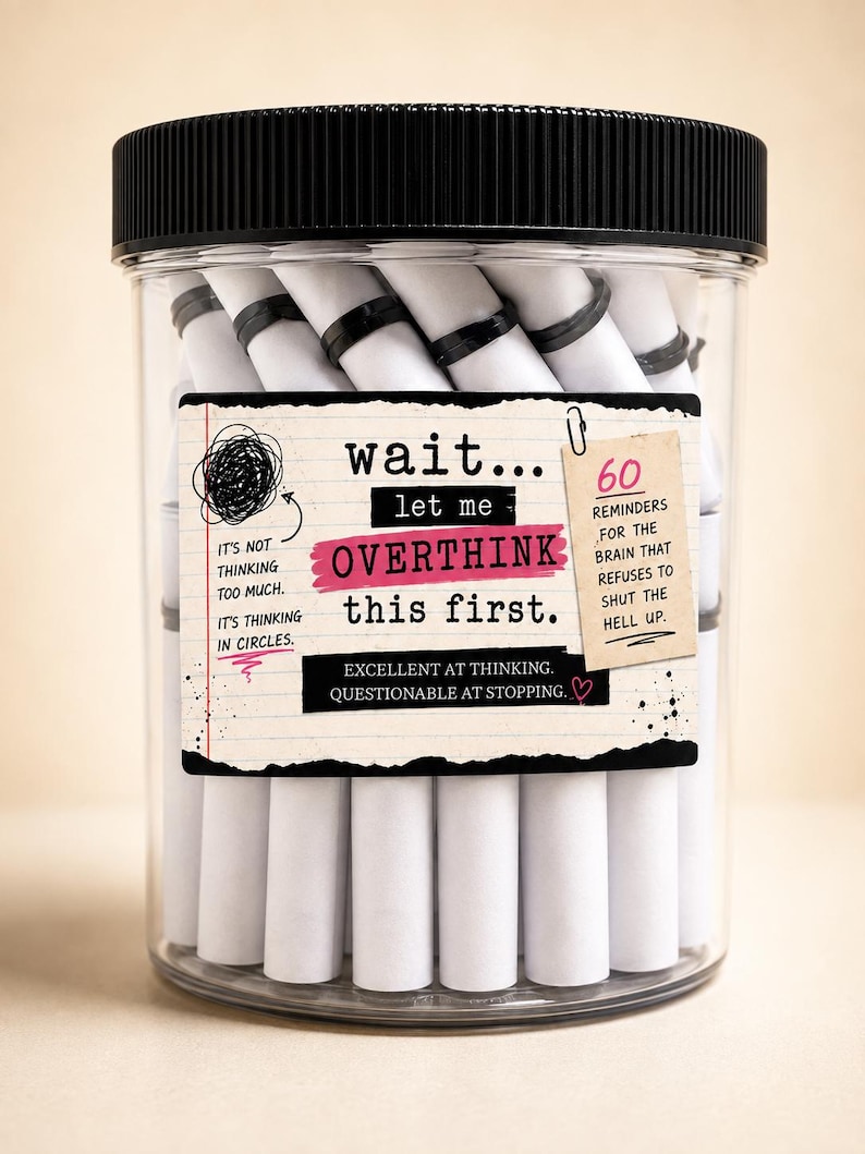 May include: A clear plastic jar with a black lid filled with white paper scrolls. The label reads: wait... let me OVERTHINK this first. It includes text about thinking in circles, 60 reminders for the brain, and excellent at thinking, questionable at stopping.