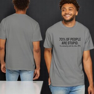 May include: A granite gray short-sleeved t-shirt featuring black text on the front that reads 70% OF PEOPLE ARE STUPID. I'm obviously with the other 40%. The shirt has a crew neckline and is shown from both the front and back views.