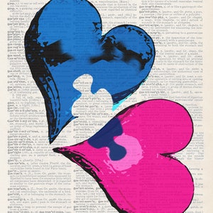 May include: Two hearts, one blue and one pink, are superimposed on a page of a dictionary. The hearts are cut out and overlap, creating a unique design. The dictionary page contains definitions for words related to the stomach and digestive system.