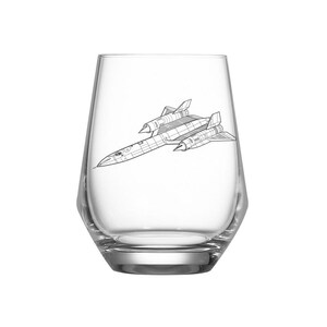 May include: A clear, stemless glass with a black and white line drawing of an SR-71 Blackbird aircraft. The glass has a wide, rounded shape with a thick base.