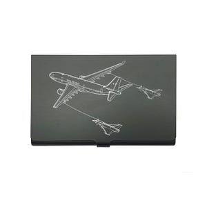 May include: A black business card holder featuring a white outline of an aeroplane and two fighter jets. The text "ROYAL AIR FORCE" is displayed on the aeroplane. The holder is rectangular in shape.