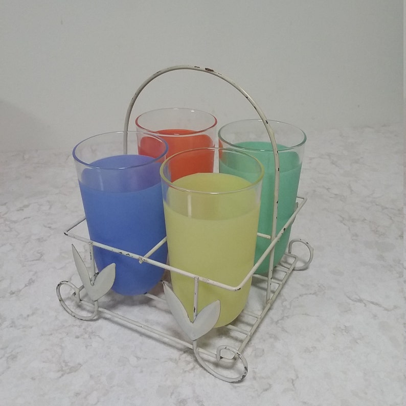 Classic 1940s kitchen. Rare vintage multi-colored glassware with handy metal carrier