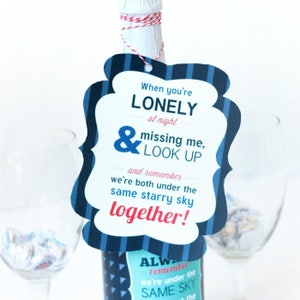 May include: A blue and white striped gift tag with the text "When you're LONELY at night & missing me, LOOK UP and remember we're both under the same starry sky together!"