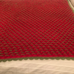 Crochet 3D Strawberry throw blanket for babies and toddlers. (Deafblind artist, see bio.)