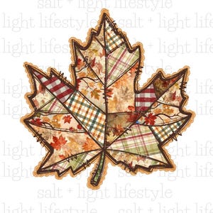 May include: A decorative maple leaf design with a patchwork pattern. The leaf features various autumn-themed fabrics, including plaid and leaf prints, in shades of red, orange, green, and brown. The leaf is outlined with a brown border and a lace-like trim.