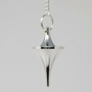 May include: A silver metal pendulum with a pointed tip and a chain.