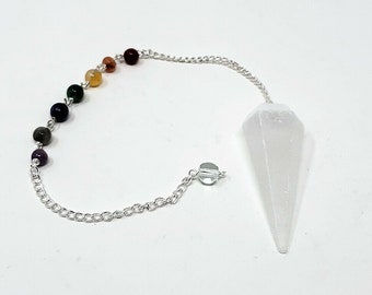 May include: A white selenite crystal pendulum with a silver chain and a rainbow of chakra beads.