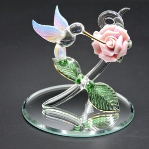 Handmade Glass Mini Rose Hummingbird a Pink Glitter covered Porcelain Flower.