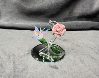 Handmade Glass Mini Rose Butterfly on a Pink Glitter covered Porcelain Flower.