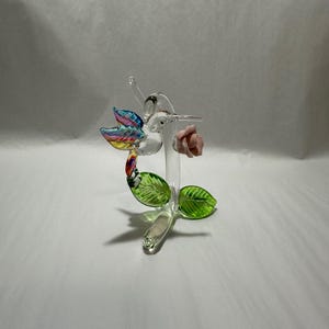 Handmade Glass Mini Rose Hummingbird a Pink Glitter covered Porcelain Flower.