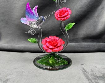 Hand Made Glass Hummingbird with a Red Glitter covered Porcelain Flower.