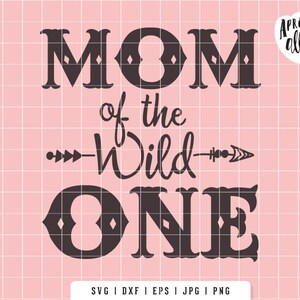 May include: A digital design with the text "MOM of the Wild ONE" in a dark brown color, with an arrow design. The design is on a pink grid background. The Apricot Ally logo is in the upper right corner.
