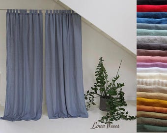 May include: Two light blue linen curtains hanging from a curtain pole. The curtains are gathered at the top and have a relaxed, casual look. The curtains are in a room with a white ceiling and white walls. A potted plant is in the foreground. The text "Linen Waves" is at the bottom of the image.