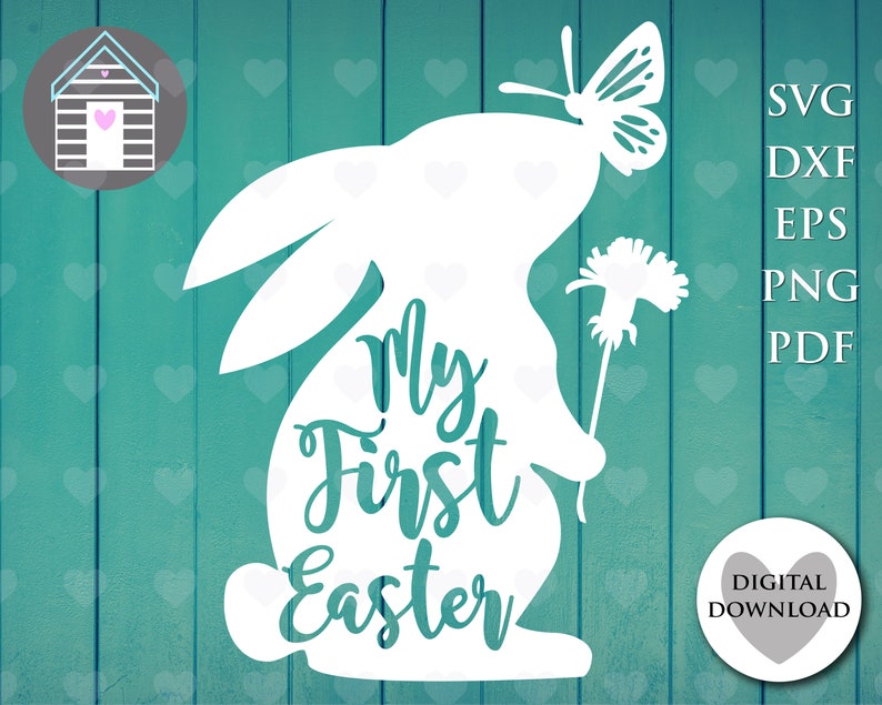 May include: White silhouette of a bunny rabbit holding a flower with a butterfly on its head. The text "My First Easter" is written on the bunny's body.