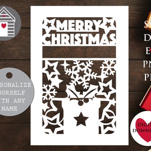 May include: White paper cut-out design with the words "Merry Christmas" at the top. The design features snowflakes and stars. The design is suitable for a card or a decoration.