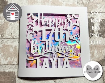 Op de afbeelding: Witte kaart met een uitgesneden ontwerp met de woorden "Happy 17th Birthday Layla" met sterren en een holografische achtergrond.
